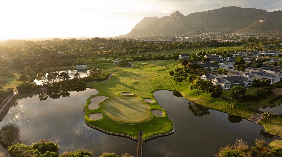 Island green surrounded by water at golden hour on a Cape Town golf course